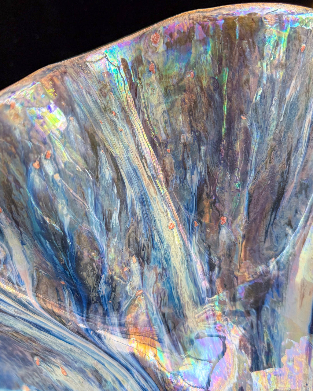 Close detail of silver and blue luster on hand built stoneware