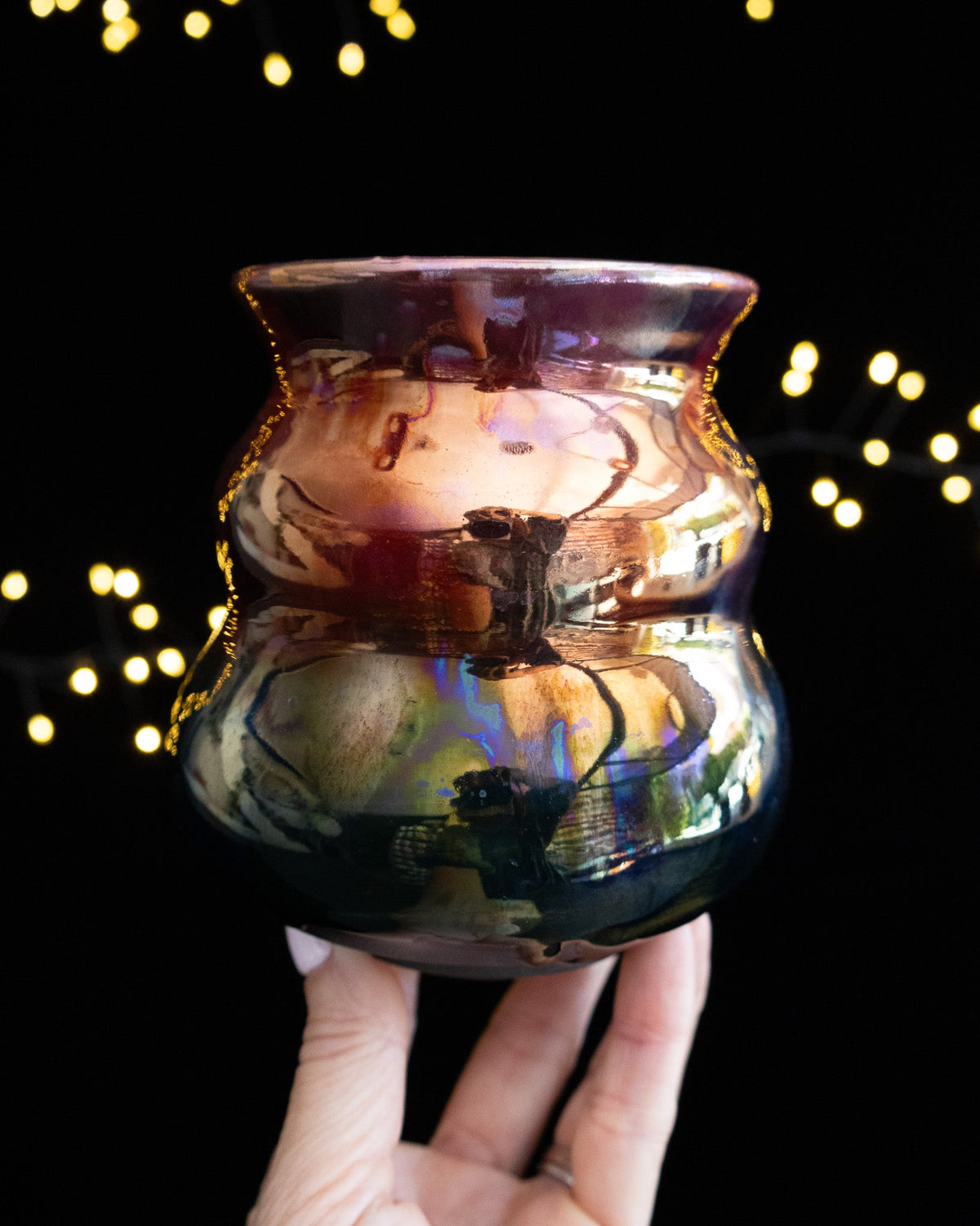Wheel thrown porcelain vase with violet rim and amber body