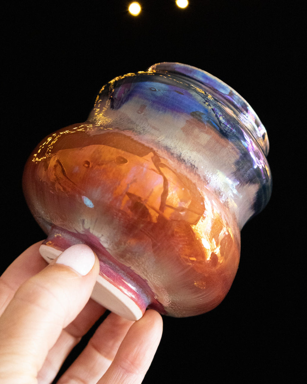 Angled view of a handmade lusterware vase