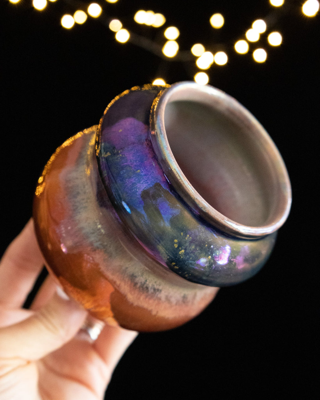 Looking into the mouth of a handmade lusterware vase