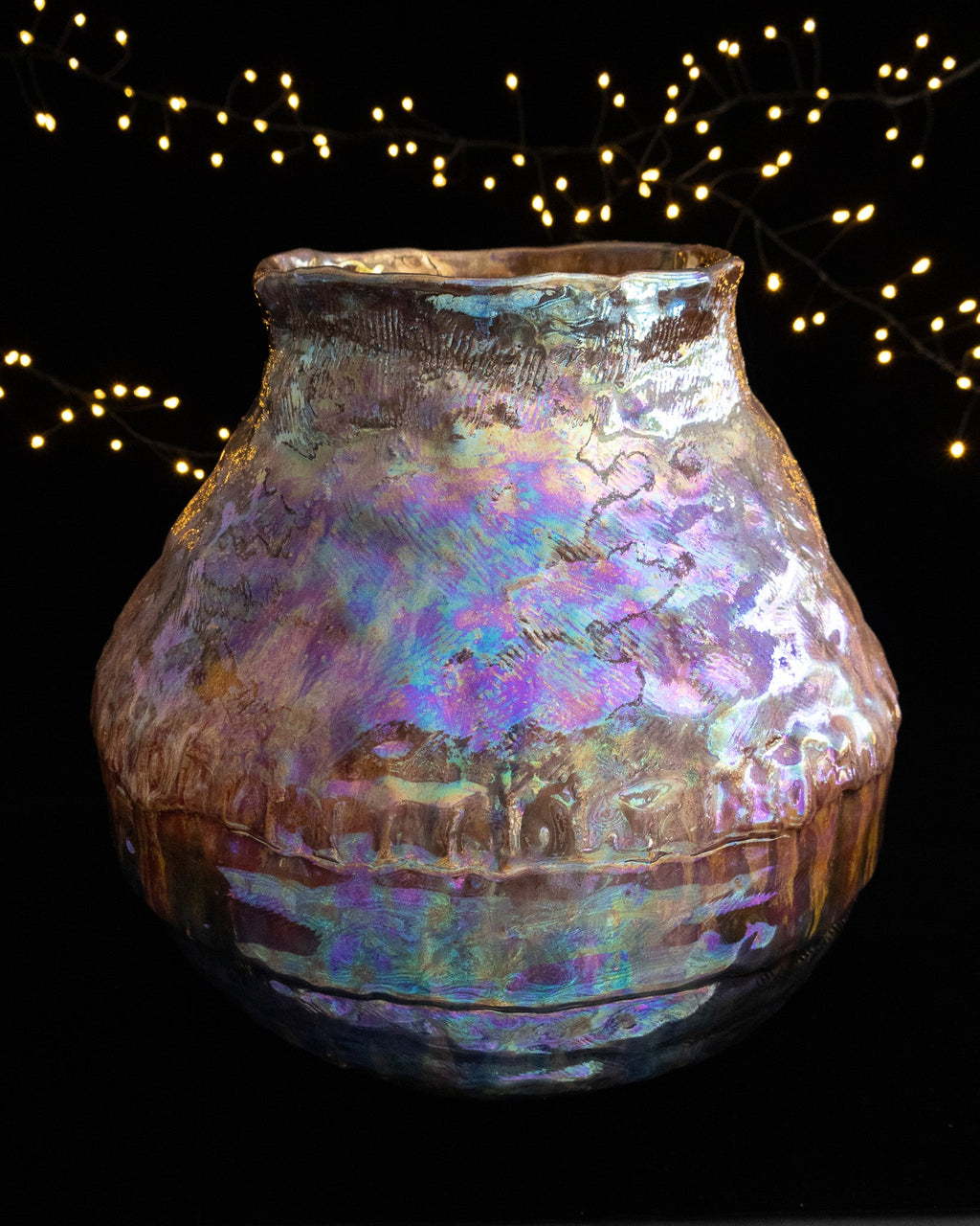 Coiled and textured surface under in-glaze luster on a large ceramic pot