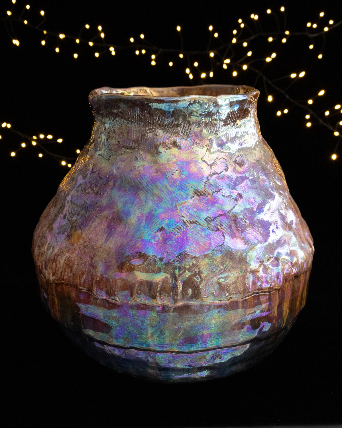 Coiled and textured surface under in-glaze luster on a large ceramic pot
