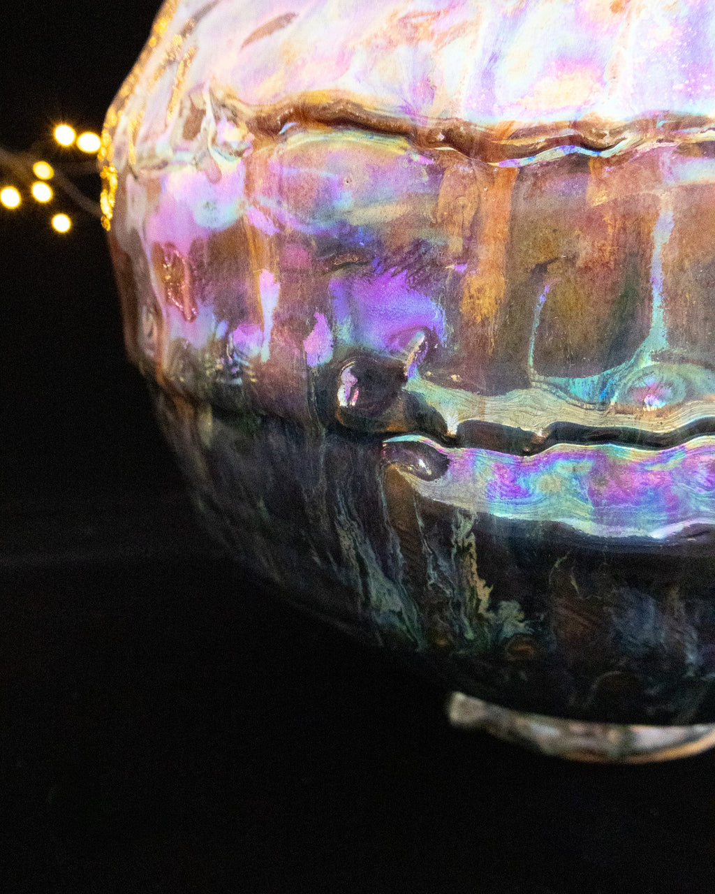 Close detail of the textured ridge on a large lusterware pot