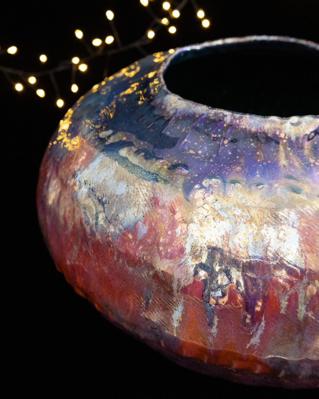 Crimson and violet in-glaze luster on hand built stoneware