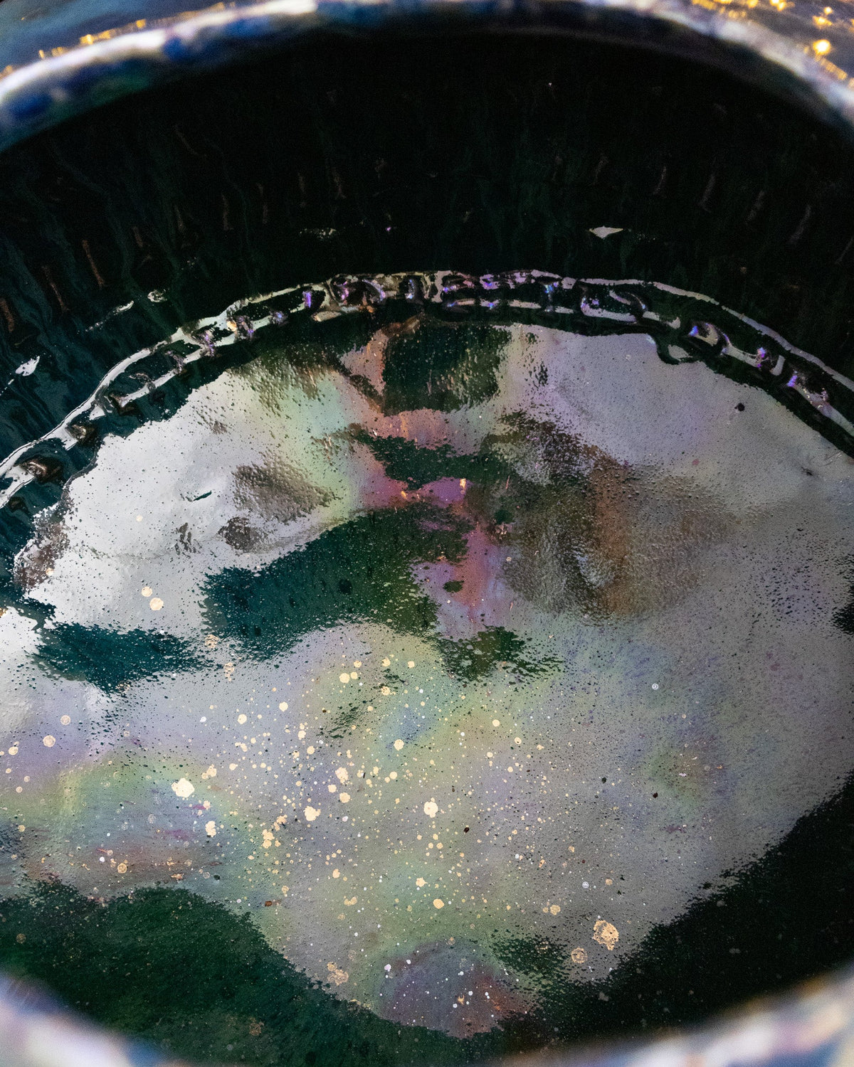 Looking into the mouth of a large lusterware pot