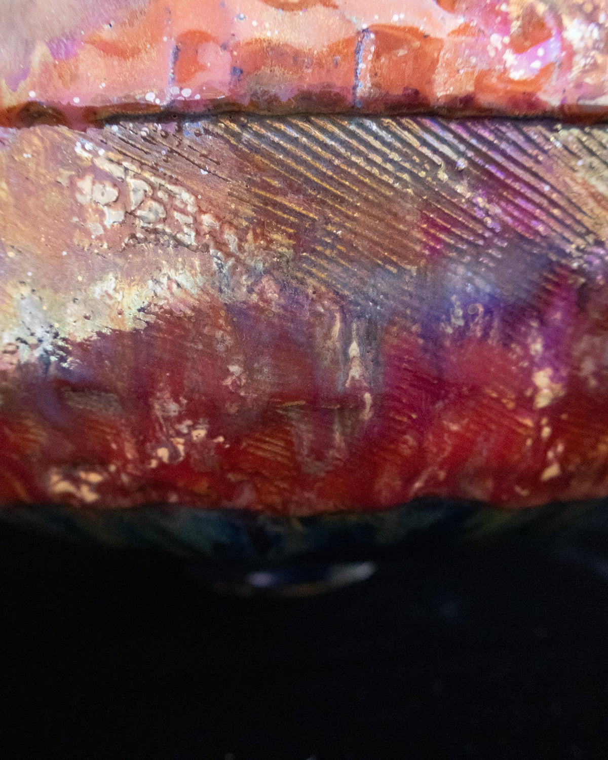 Close detail of the textured band around a hand built stoneware pot