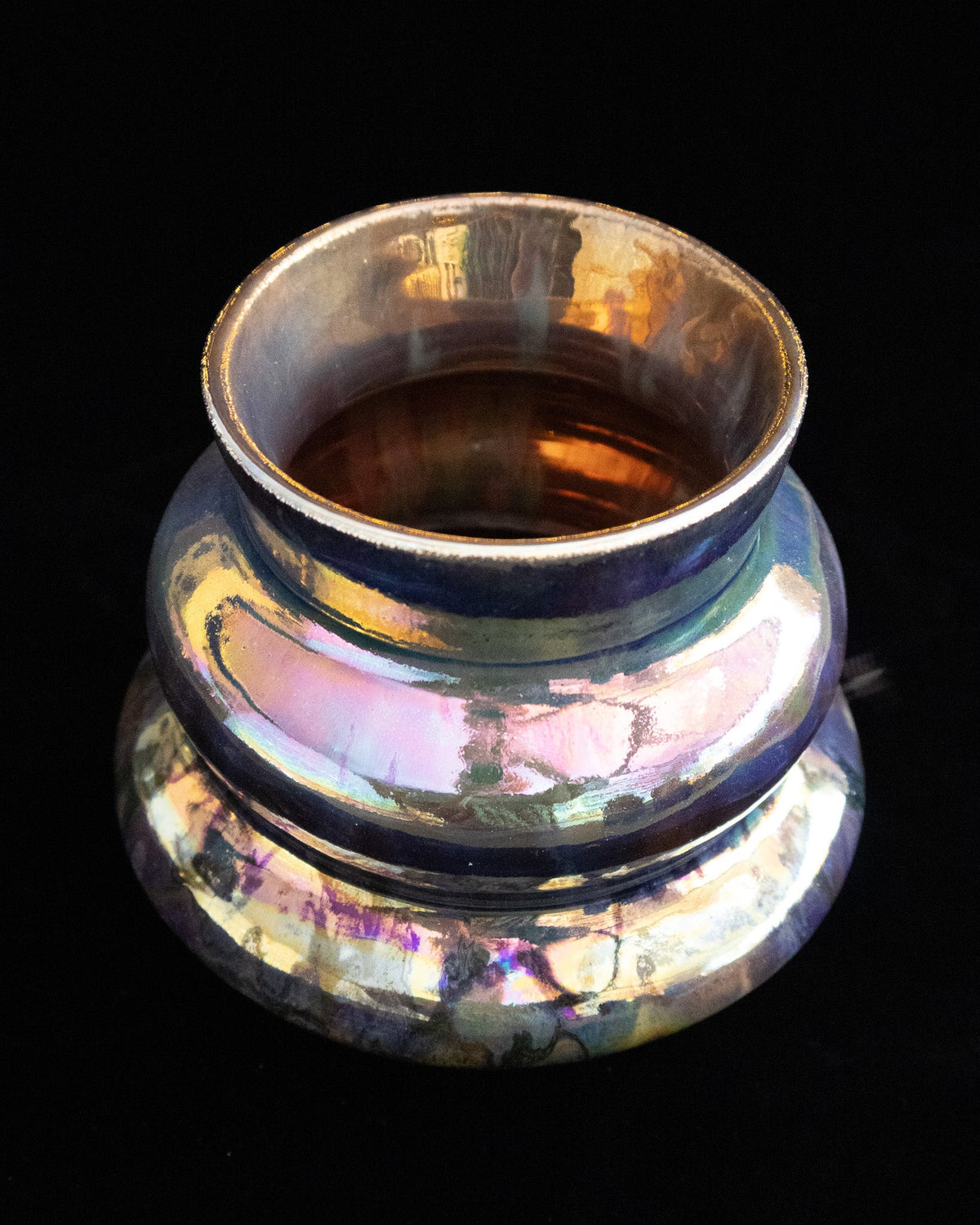Looking into the mouth of a tiered handmade vase