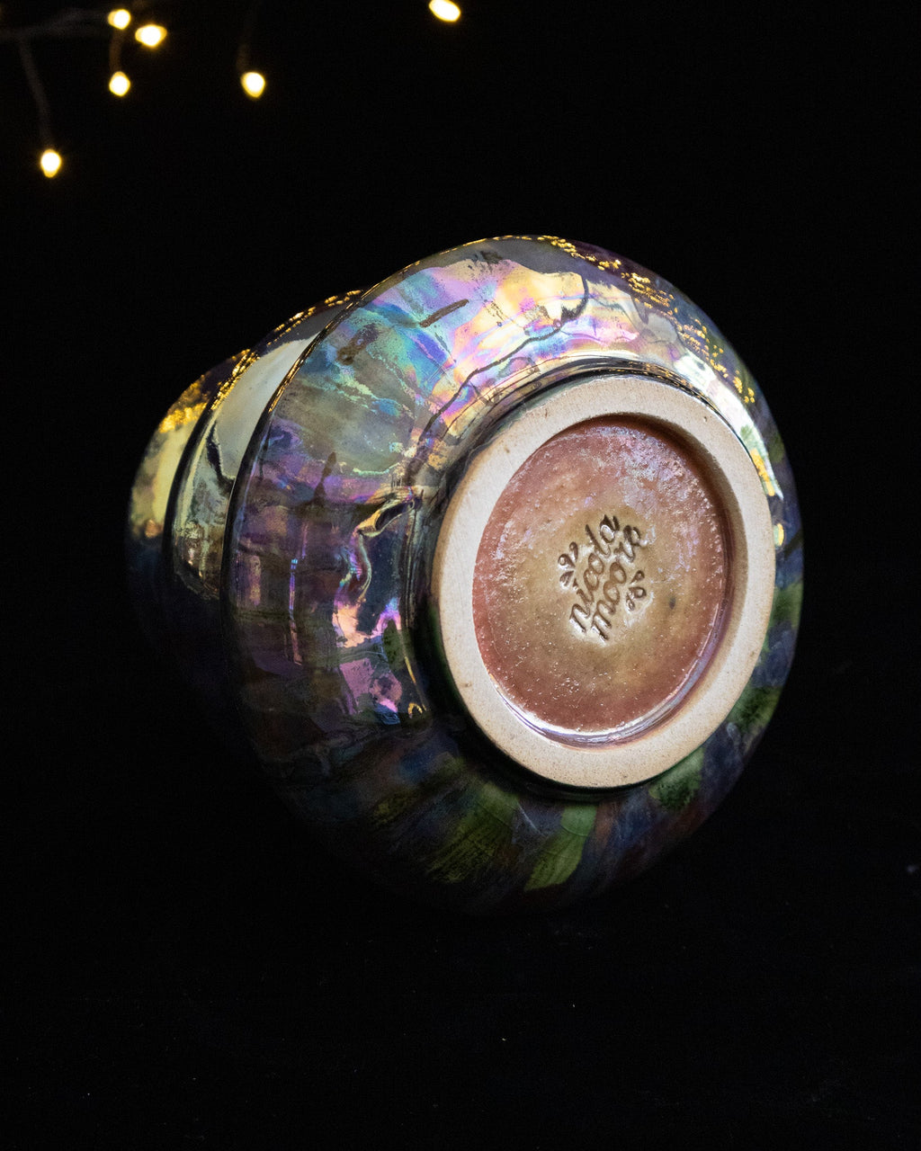 Underside of a wheel thrown porcelain lusterware vase