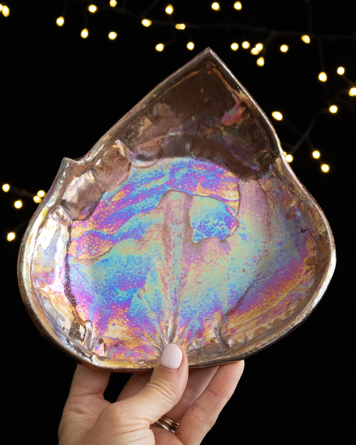 Leaf shaped lusterware keepsake plate with blue, violet and pink iridescence