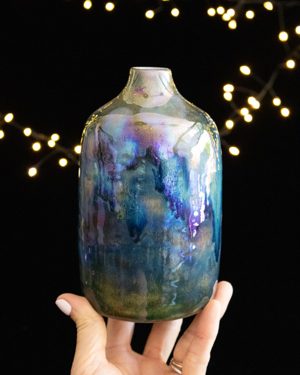 Hand thrown porcelain bottle with iridescent blue in-glaze luster