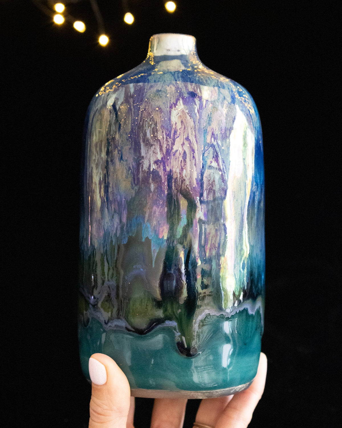 Handmade lusterware daydream bottle in violet and blue over bright turquoise