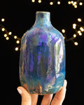 Hand thrown porcelain bottle scattered with tiny bright points