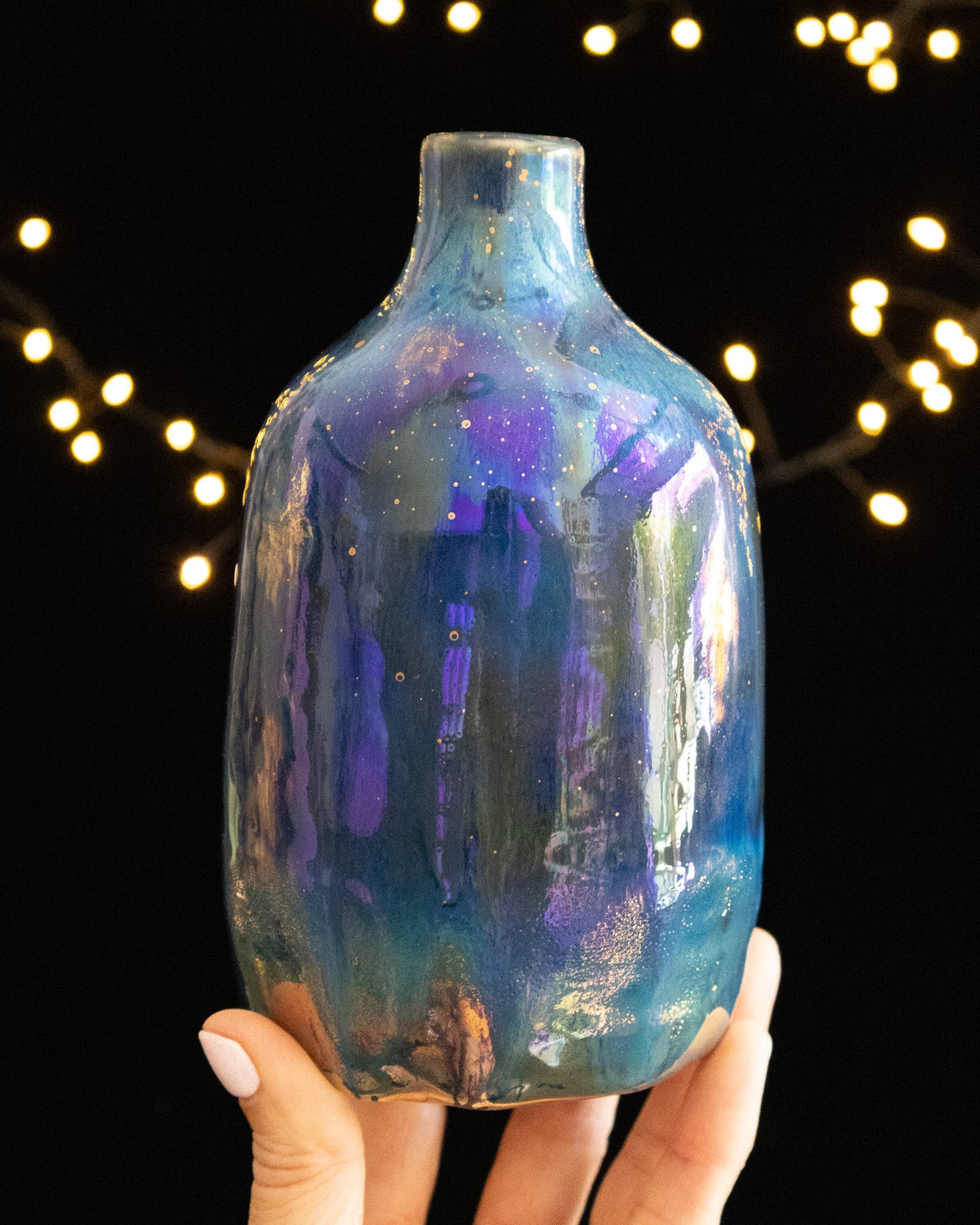 Hand thrown porcelain bottle scattered with tiny bright points