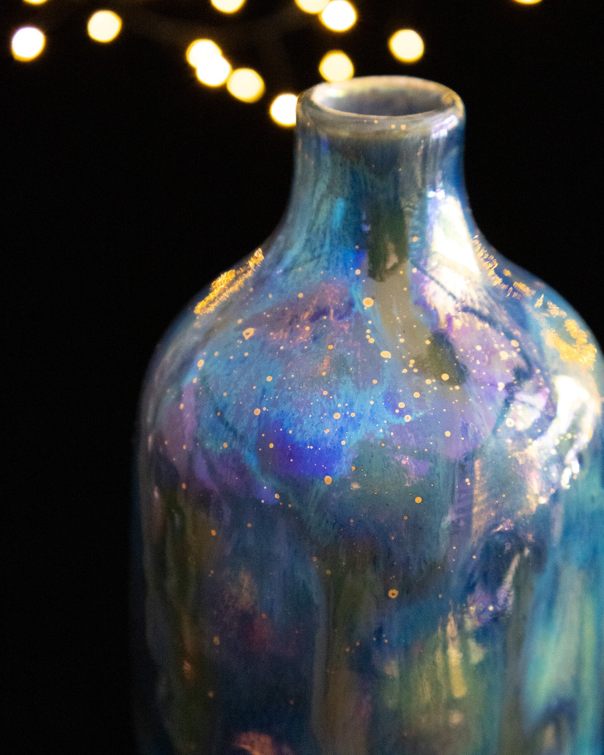 Close detail of blue and violet in-glaze luster on handmade porcelain