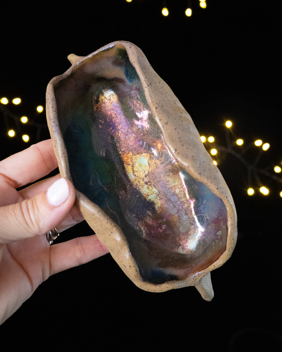 Handmade lusterware star seed pod seen from above