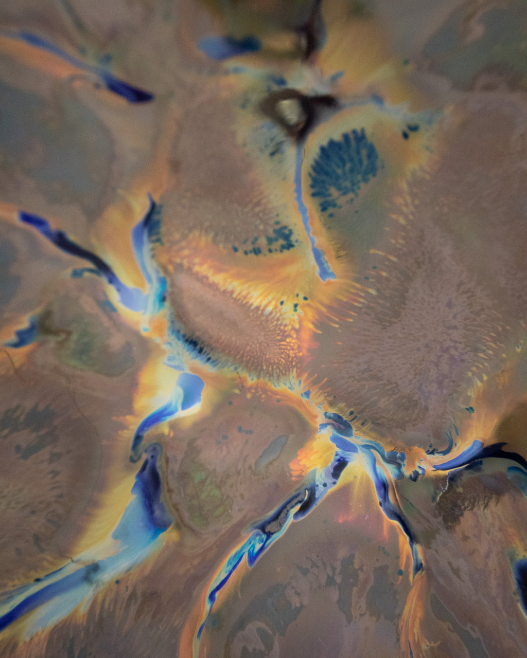 Close detail of in-glaze luster on a hand built stoneware bowl