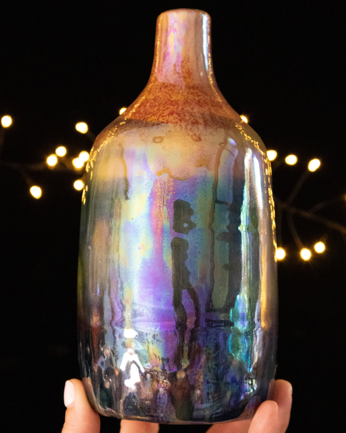 Hand thrown porcelain bottle with rainbow in-glaze luster