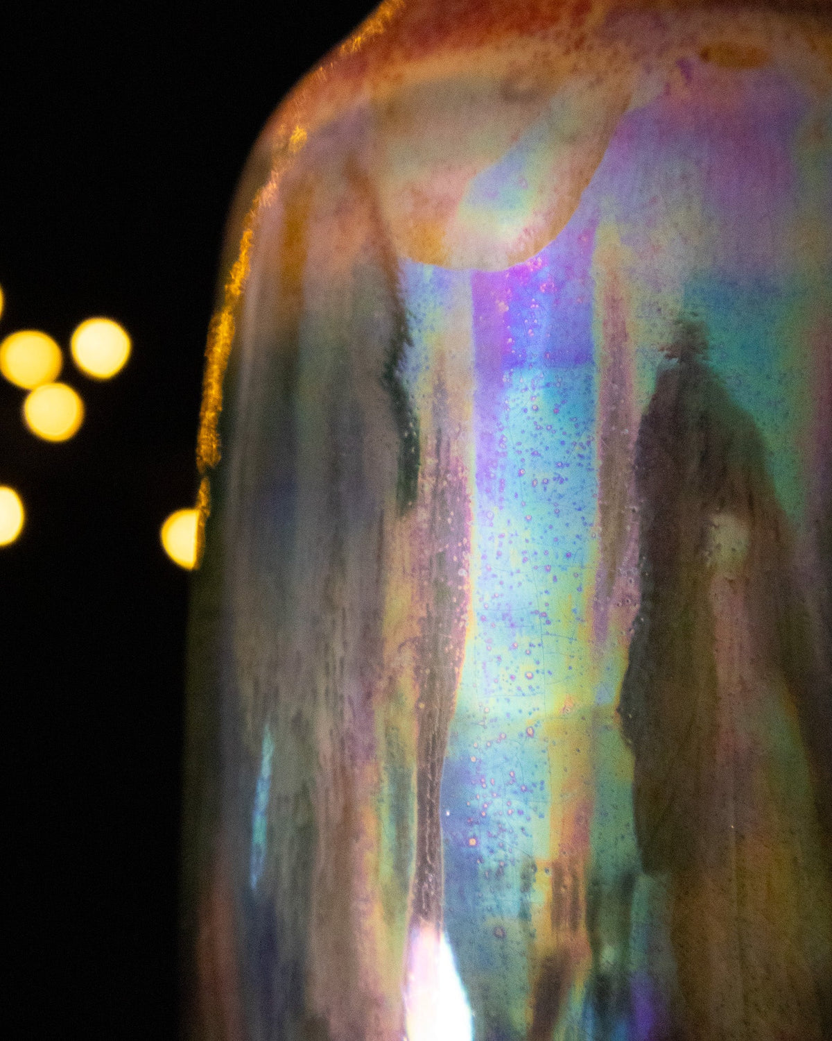 Close detail of rainbow luster running down handmade porcelain