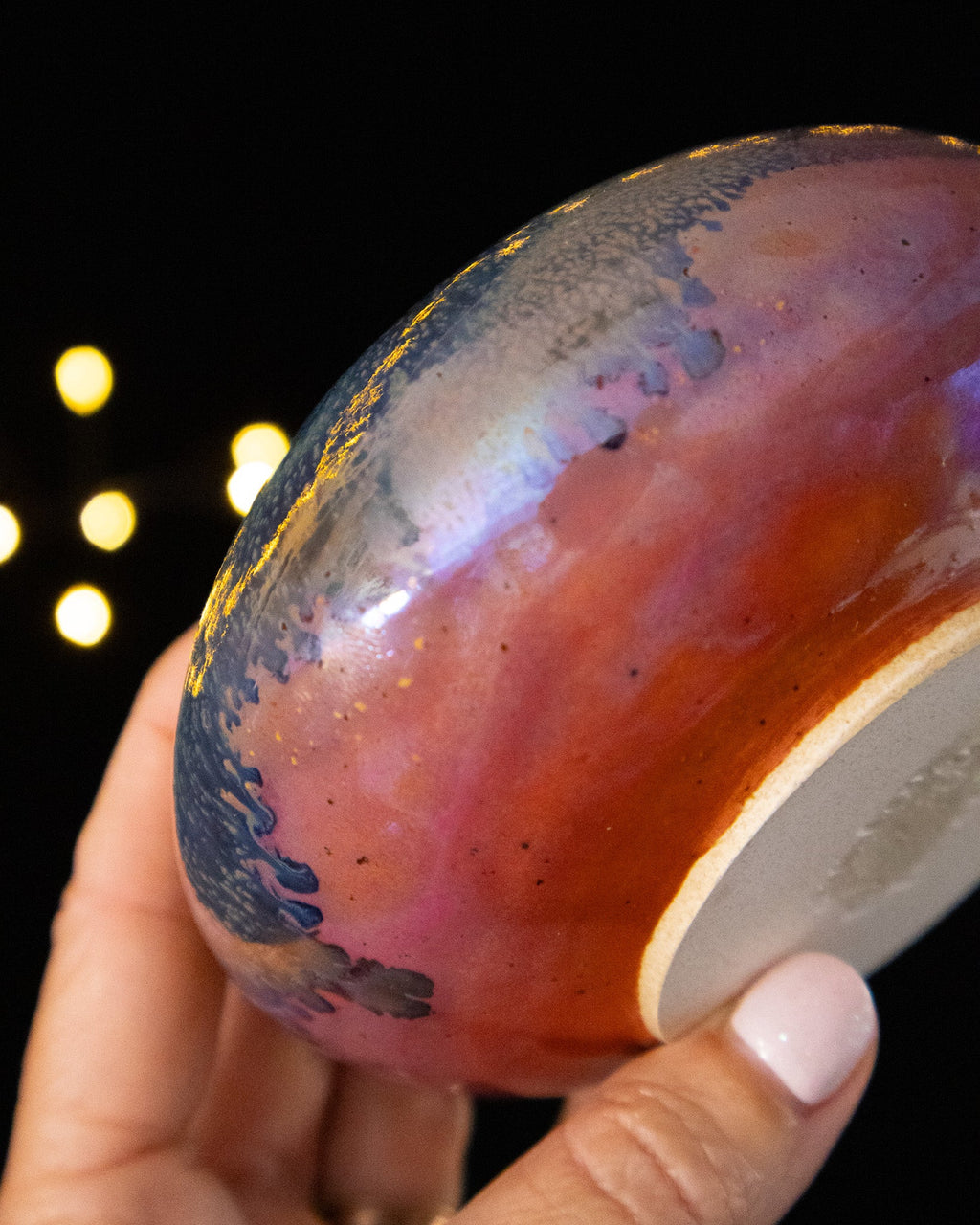Underside of a handmade lusterware bud vase