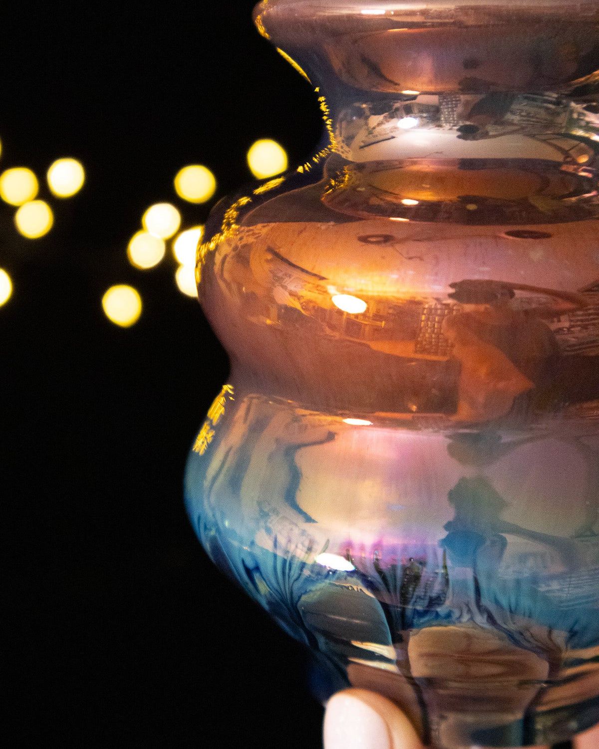 Close detail of copper luster dropping into deep blue