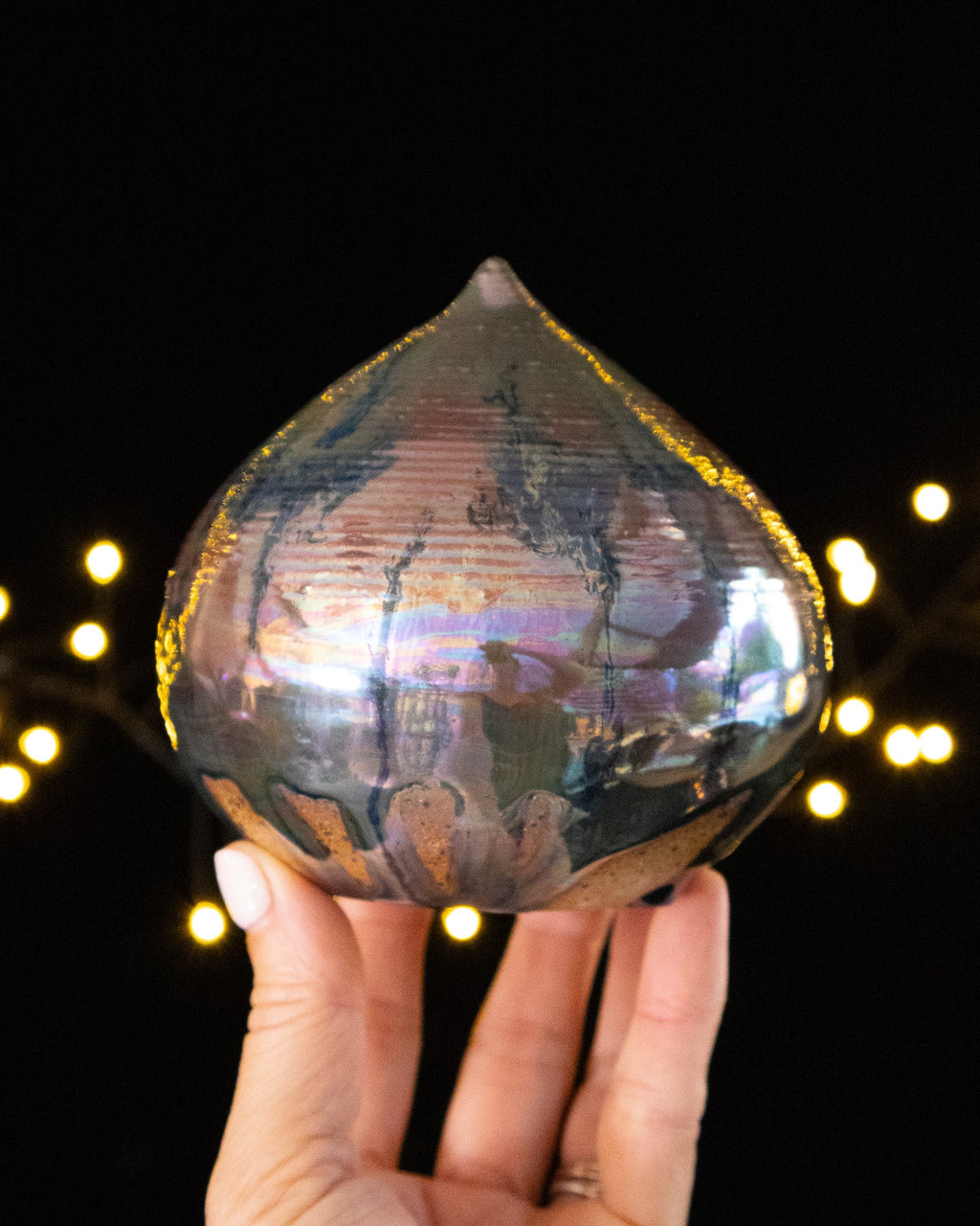 Handmade droplet form sound sculpture with pearlescent pink and green iridescence