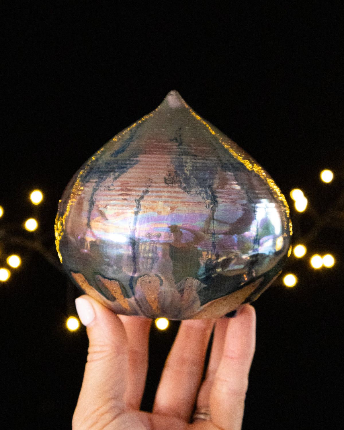 Handmade droplet form sound sculpture with pearlescent pink and green iridescence