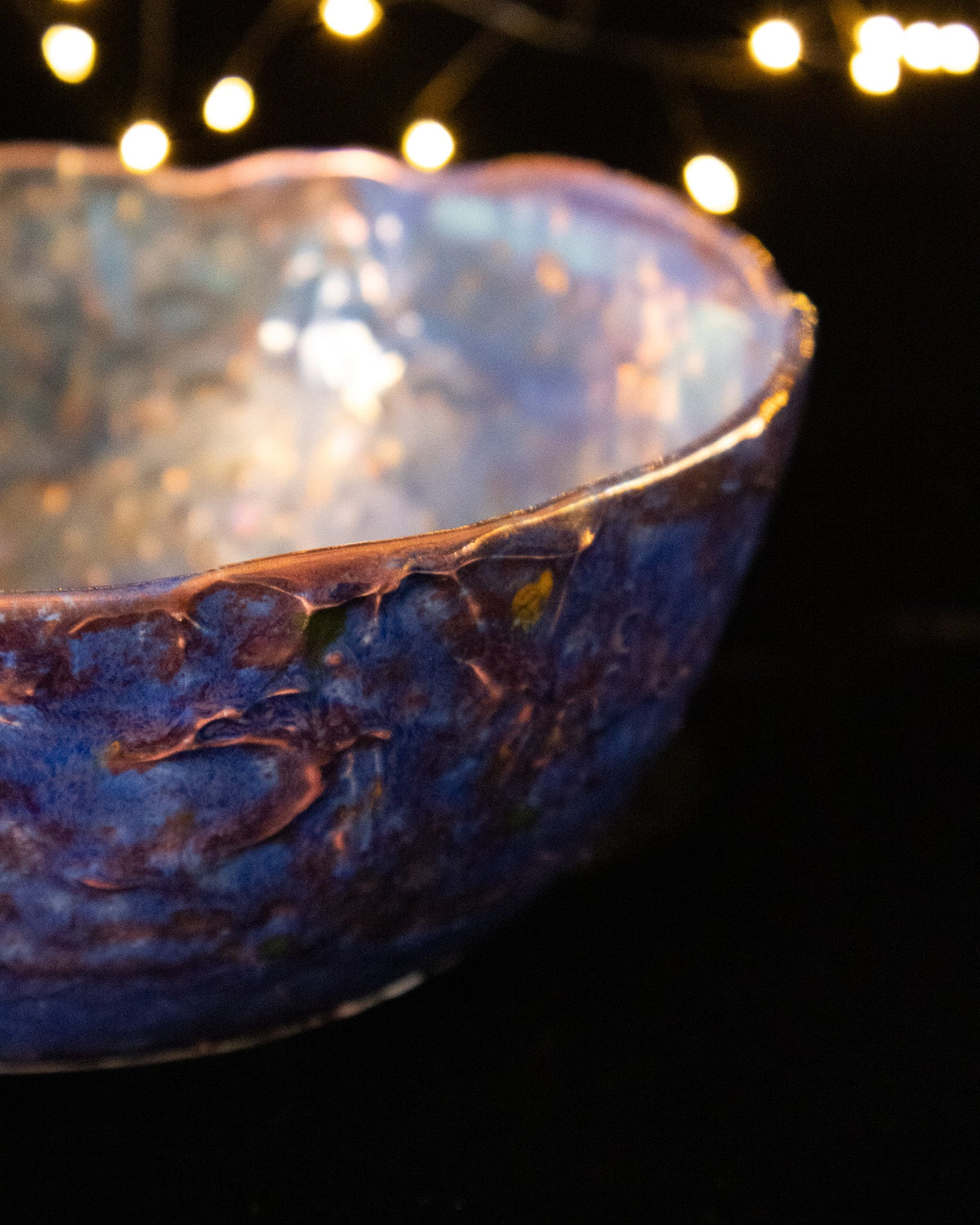 Angled view of a decorative partly fired porcelain lusterware bowl