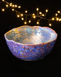 Close detail of layered luster glazes on hand built porcelain