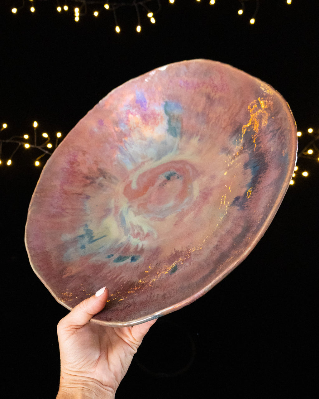 Angled view of a one of a kind lusterware bowl