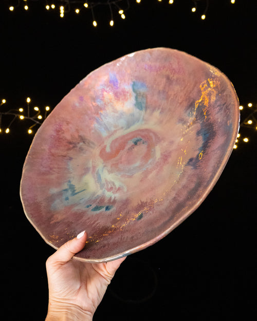 Angled view of a one of a kind lusterware bowl