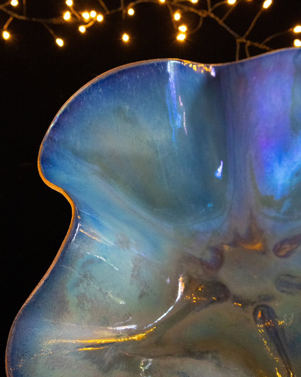 Close view of periwinkle and amber in-glaze luster on stoneware