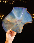 Periwinkle blue lusterware bloom sculpture held in hand
