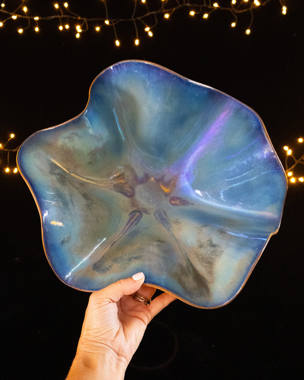 Ruffled hand built stoneware bloom sculpture in soft blue and violet