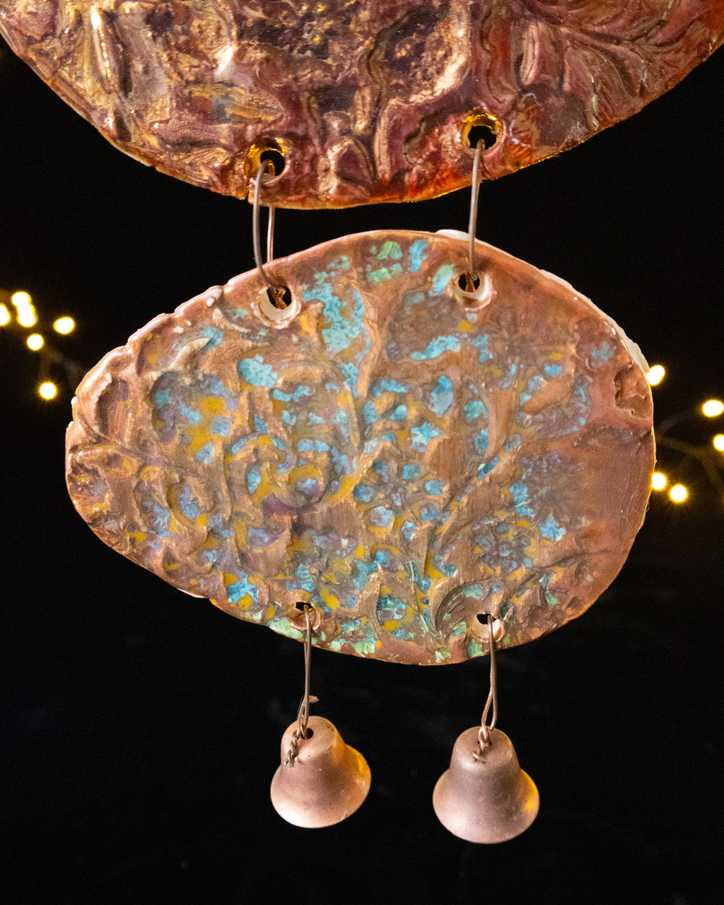 Lower panels and ceramic bells of a handmade lusterware wall chime