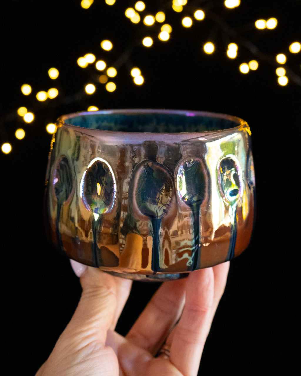 Handmade lusterware ritual cup in warm amber with deep oval impressions