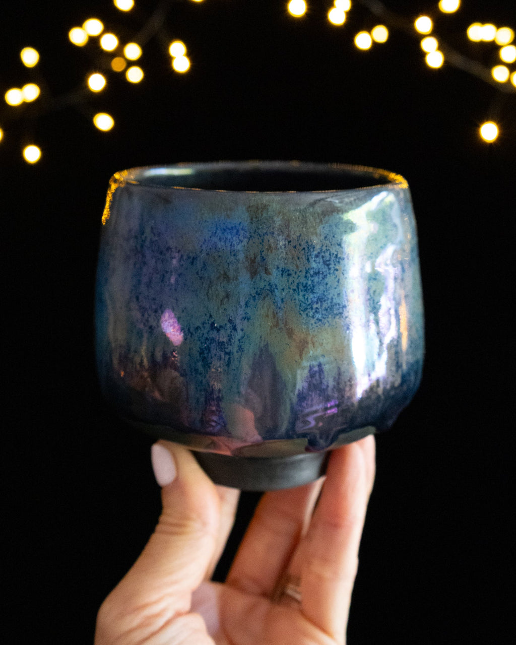 Teal and violet in-glaze luster on a wheel thrown porcelain cup