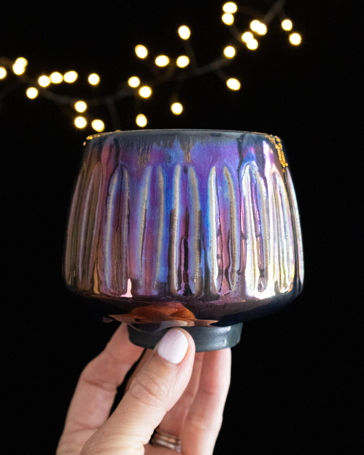 Close detail of fluted ribs under iridescent luster glaze