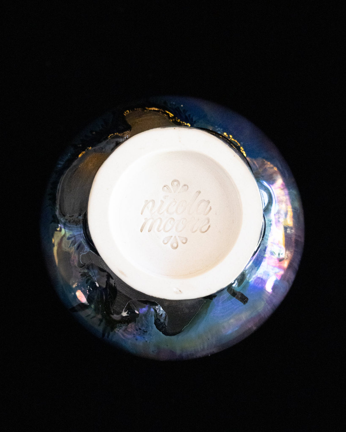 Base of a lusterware ritual cup with the maker's stamp