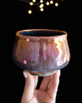 Deep amber in-glaze luster with violet at the rim on wheel thrown porcelain