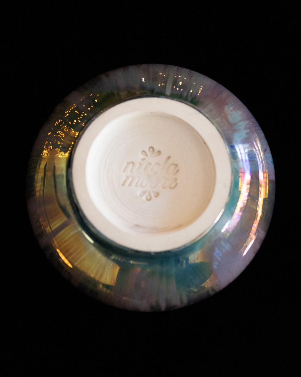 Base of a handmade lusterware ritual cup with the maker's stamp