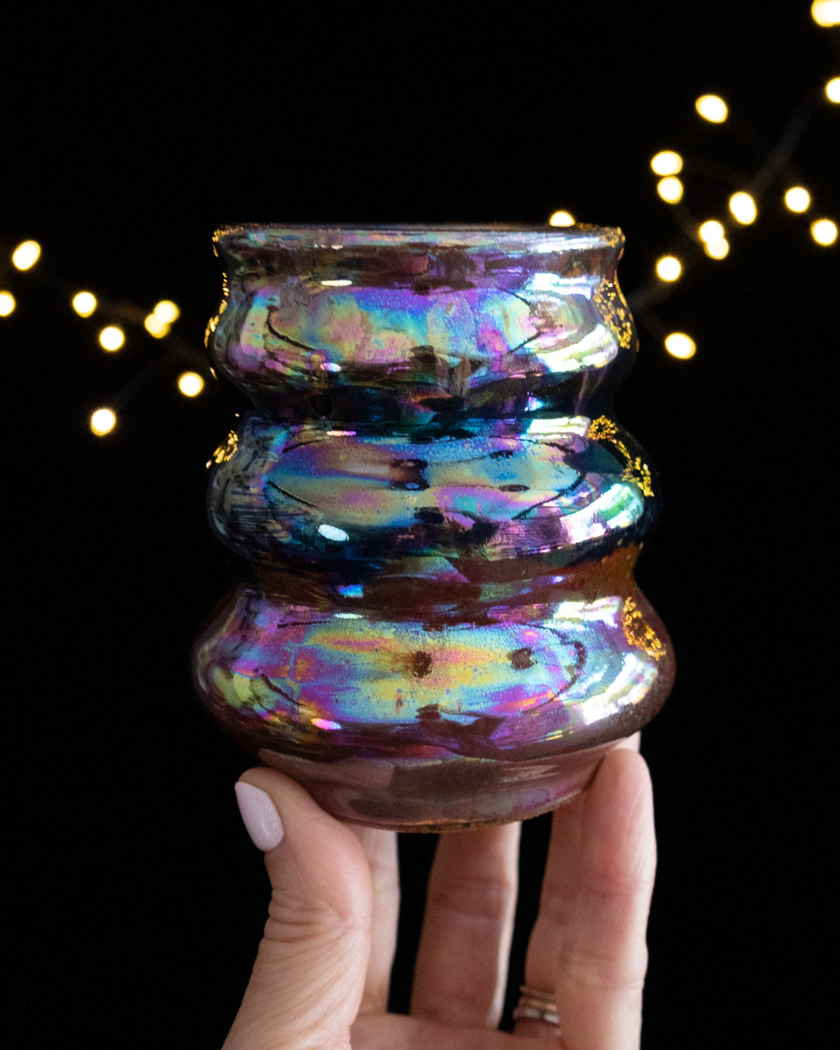Rainbow in-glaze luster running pink into green and teal on porcelain