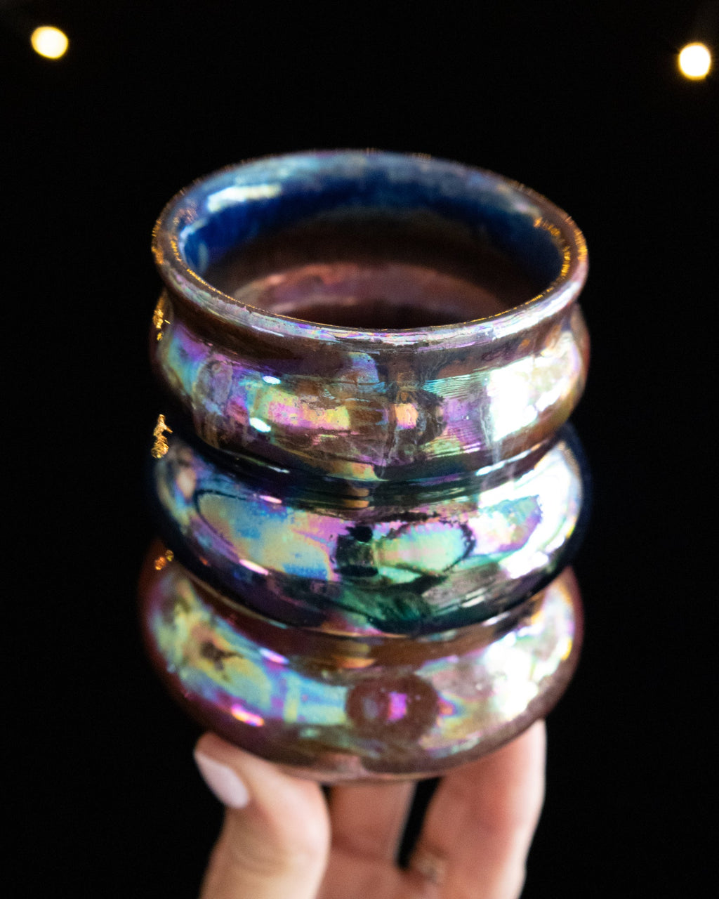 Looking into a rainbow lusterware curvy cup from above